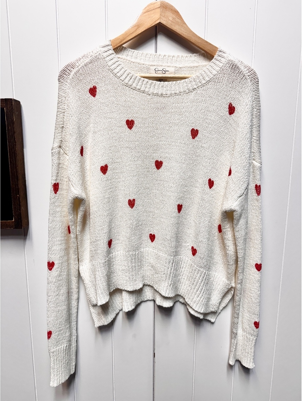 White sweater with red hearts